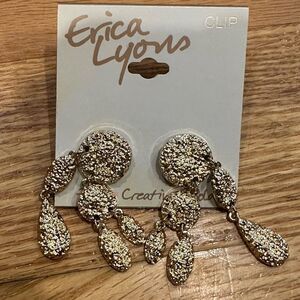 Erica Lyon's clip on earrings dangle gold textured